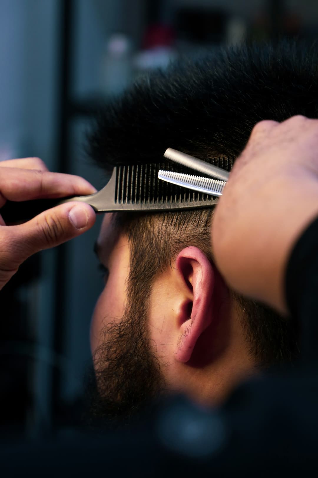 Thinning shears over comb, scissor work close-up